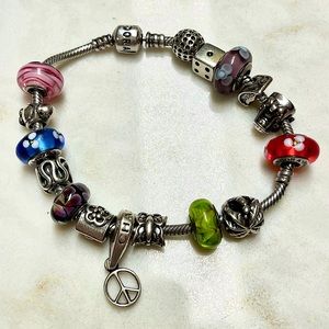 Pandora bracelet size 8.3 with 16 charms